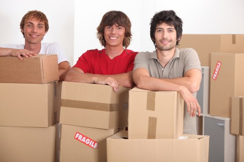 Professional movers handling furniture with care
